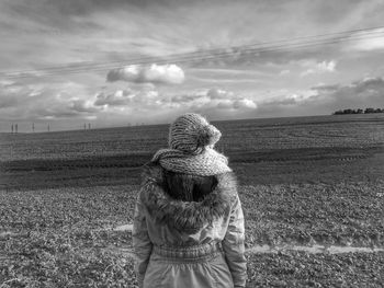 Scenic view of landscape against cloudy sky