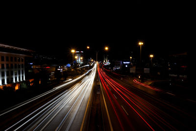 High angle view of light trails on highway at night