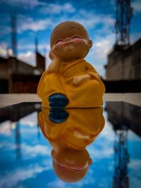 Close-up of a boy sculpture in swimming pool