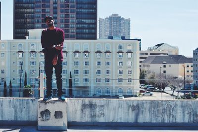High angle view of woman standing in city