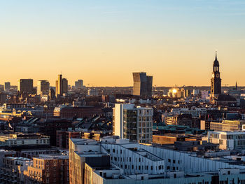 High angle view of buildings against sky during sunset