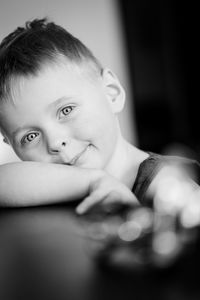 Portrait of boy siting at home