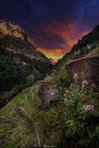 Scenic view of mountains against sky at sunset