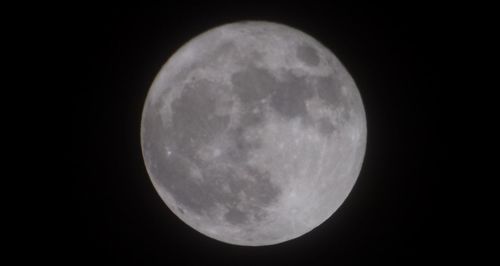 Scenic view of moon against sky at night