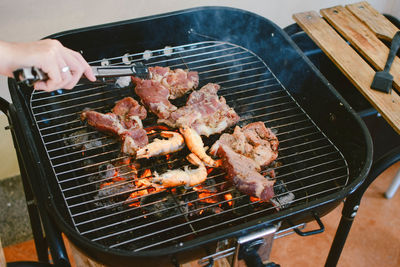 Close-up of meat on barbecue grill