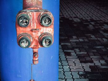 Close-up of rusty metal against wall