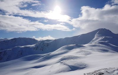 Scenic view of snowcapped mountains against sky