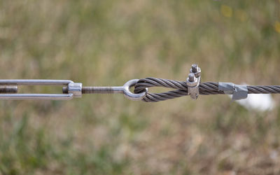Close-up of metal chain on field