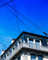 Low angle view of building against blue sky