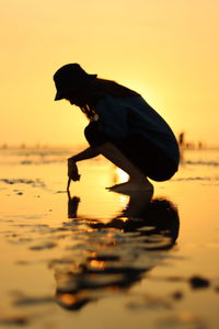 Silhouette woman on beach