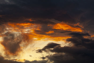 Low angle view of dramatic sky during sunset