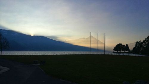 Scenic view of lake against sky during sunset