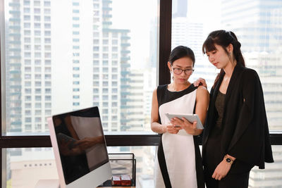 Young woman using laptop in office