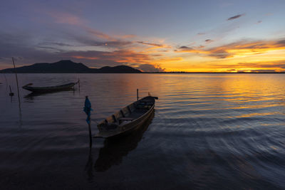 Scenic view of lake against sky during sunset