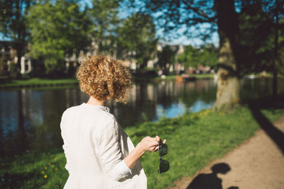 Woman walking on pathway at park