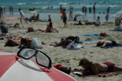 Close-up of swimming goggles on beach