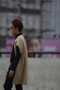 Side view of young man looking away