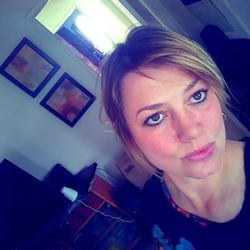 Portrait of smiling woman at home