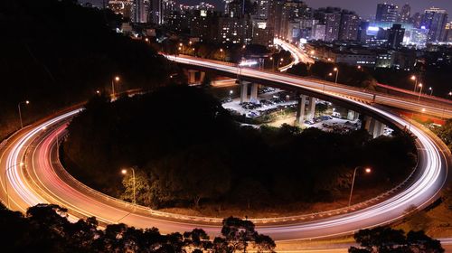 High angle view of light trails on highway at night