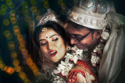 Close-up portrait of smiling couple