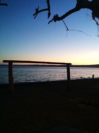 Scenic view of sea against clear sky during sunset