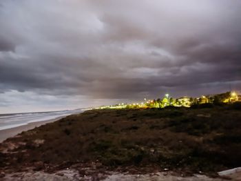 Scenic view of landscape against cloudy sky