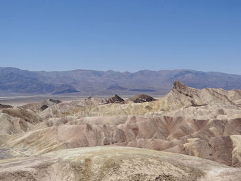 Scenic view of desert against clear sky