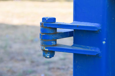 Close-up of metallic container on wood