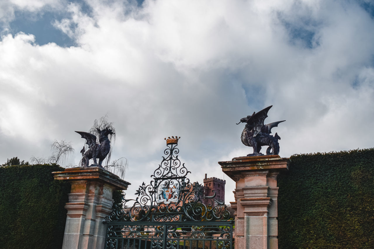 LOW ANGLE VIEW OF STATUES AGAINST SKY