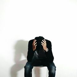 Woman standing against white background