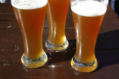 Close-up of beer glass on table