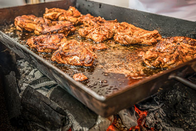 High angle view of meat on barbecue grill