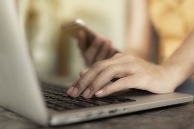 Close-up of woman using mobile phone