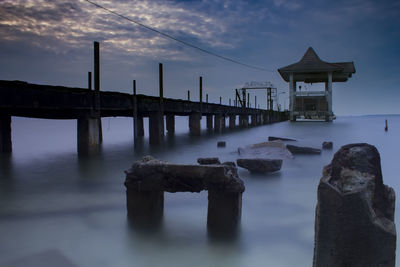 Bridge over sea against sky