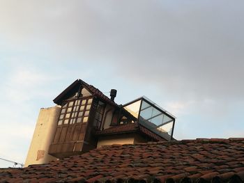 Low angle view of roof against sky