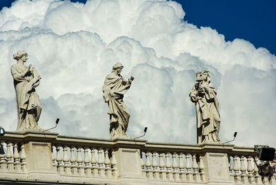 Low angle view of statue against cloudy sky