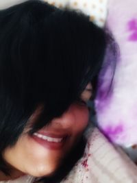 Close-up portrait of a smiling young woman