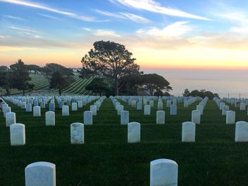 View of cemetery against sky during sunset