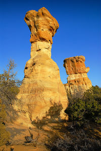 Rock hoodoo against clear sky