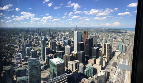 Aerial view of modern buildings in city against sky