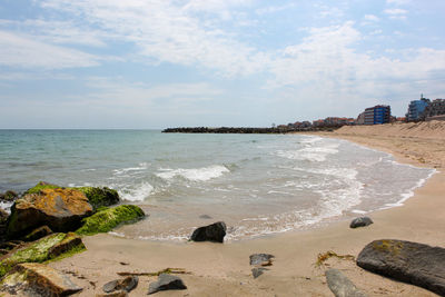 Scenic view of beach against sky