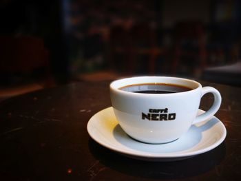 Close-up of coffee cup on table