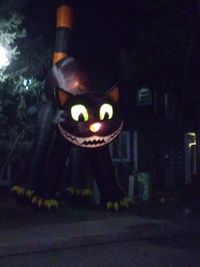 Close-up of lit candles in the dark
