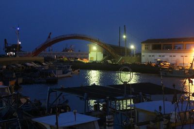 Boats in harbor at night