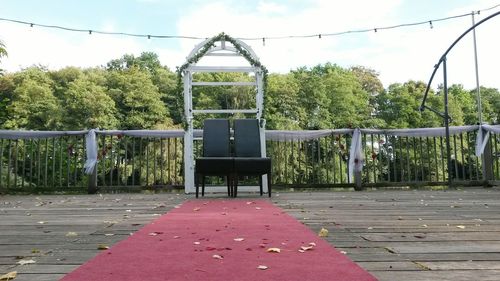 Empty park with trees in background