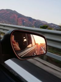 Reflection of car on side-view mirror