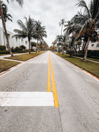 Empty road against sky