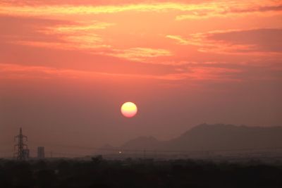 Scenic view of silhouette landscape against romantic sky at sunset