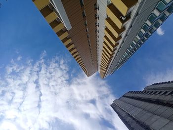 Low angle view of modern buildings against sky