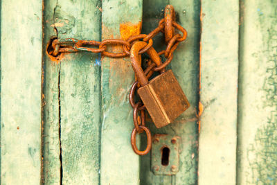 Close-up of padlock on metal door